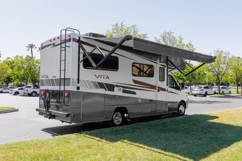 Exterior of 2020 Vita Winnebago 24 F - Power Awning in out position.