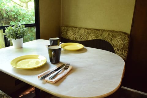 Enjoy a meal in air conditioned comfort. Dinette converts into a bed.