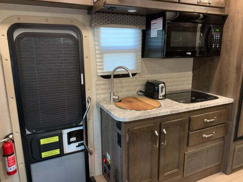 Kitchen (Sink, Stove, convection/microwave oven, lots of storage