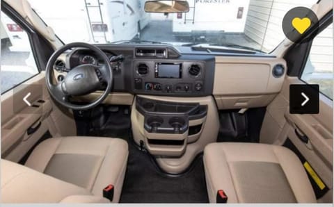 Check out this very comfortable and clean front cab/driving area...perfect for traveling any distance!