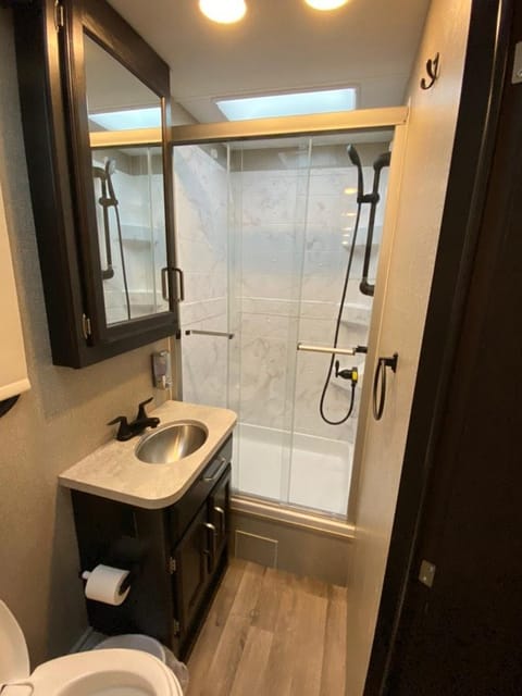 Bathroom equipped with sliding glass shower doors