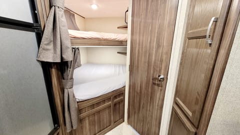 The bunks are full size so you can sleep four in this area alone!