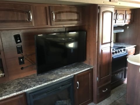 48" TV and fireplace
