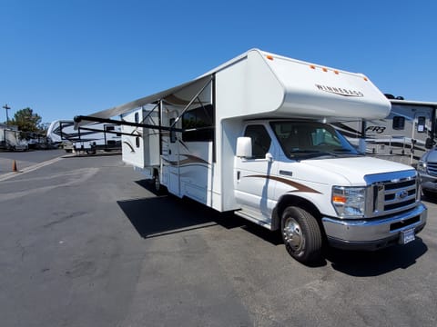 Electric awning which only takes seconds to set up and enjoy the shade. (2) electric slide outs turns your RV into a spacious home.