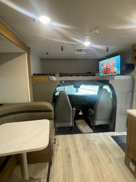 Cab over sleeping area and the tv on swing arm