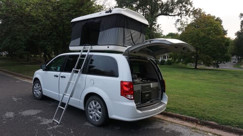 The van comfortably sleeps four and includes a kitchen