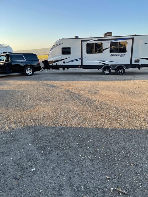 The Big Blue and White bullet Towable trailer in Evergreen