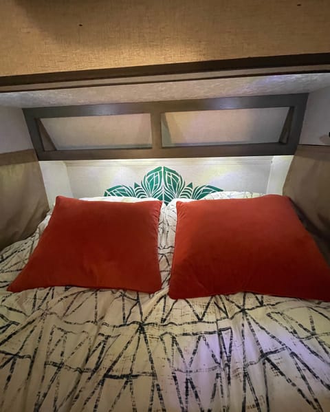 We provide you with bedding suited to your needs including: sheets, a cozy blanket, and pillows (if you don't want to bring your own... which you are certainly welcome to do). She also has lighting for days that runs off the included battery.