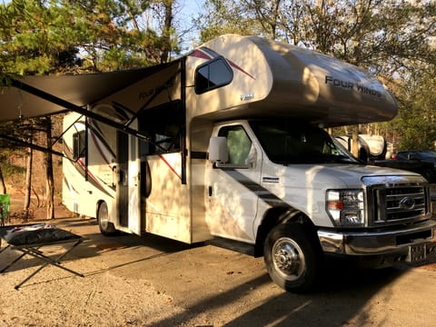 Camp side awning with LED strip lights for night time activities.