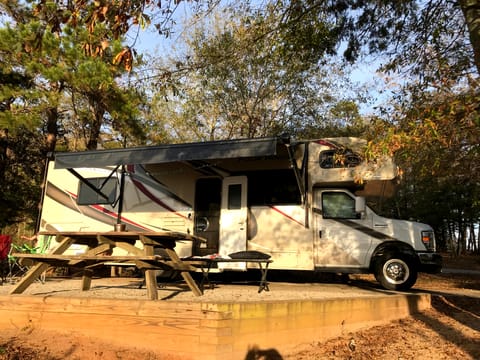 Power awning keeps sun and rain off.  Lots of outside storage in rear 'basement.'