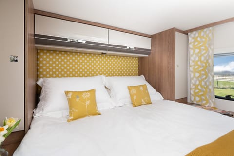 A large rear double island bed - grey-yellow interior