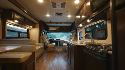 Open floor plan. Driver and Passenger chairs swivel to allow for extra seating. Table is removable while driving.