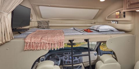 Camping so comfortably. More than a place to rest or relax, the Greyhawk Prestige’s full-bunk with a 750-pound rating boasts a lovely panoramic window with shade, storage space, over head light, and privacy curtain.