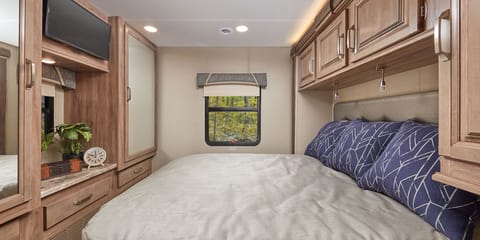 Relax and unwind. A queen-size bed with bedspread and Fan-Tastic fan provide all the comforts of home while you sleep—plus, under-bed storage gives you plenty of room for your clothes. Roller shades keep out the morning light while you rest.