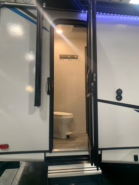 Outside entrance to the bathroom. Great for limiting foot traffic inside of the trailer.