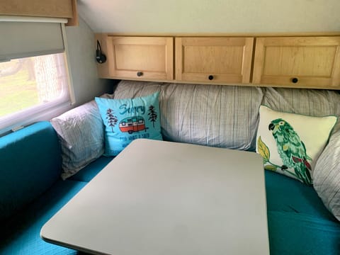 Converts to an oversized queen bed. 3" memory foam topper rolled up under cabinets included w/ duvet cover already on, so makes up in to a bed easily