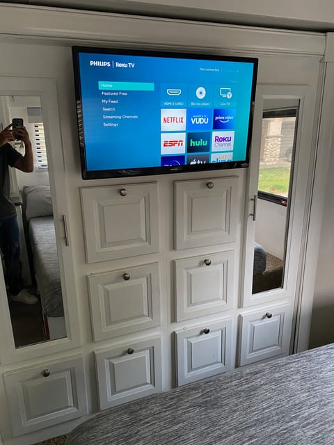 master bedroom with 40 inch smart tv