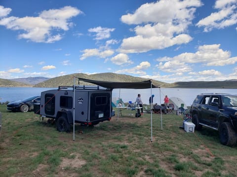 The batwing awning is fully extended here and provides the perfect shelter from sun, rain, and snow. 