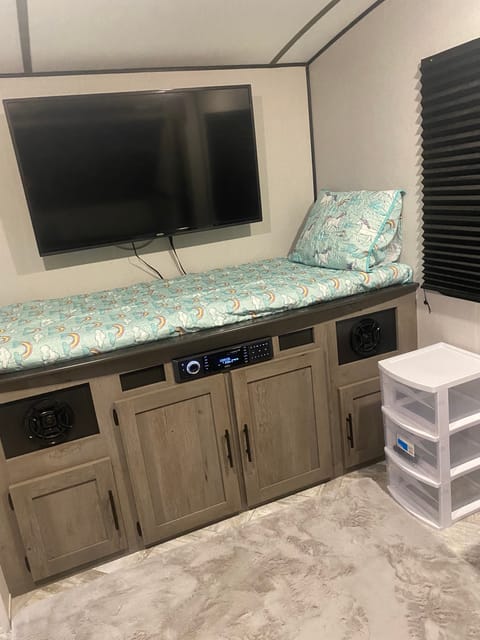 Bunk room with theater electronics for movie night