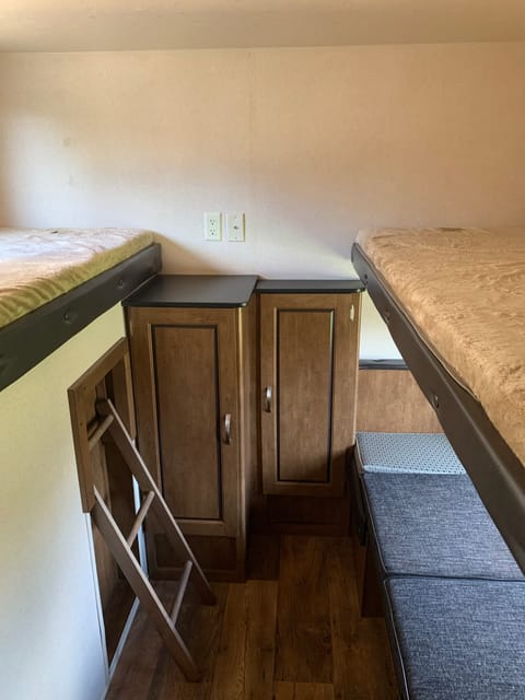 Bunk area with 3 twin bunks. Has pocket door for added privacy.