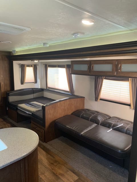 Dining area and couch folded down for extra sleepers.