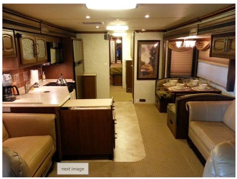 As you walk in (with slides out) you see the layout of the RV.  It has a very tasteful color scheme and does well with the exterior. 