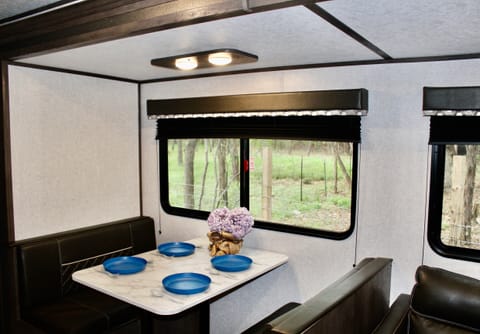 This dinette can seat four for mealtime or be laid flat for an additional sleeping space.