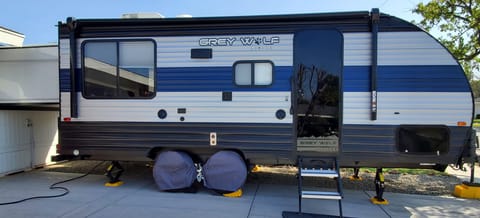 24 feet sliding out to 30 feet, power awning, outside shower, xchocks for stability, and blue evening lights. 