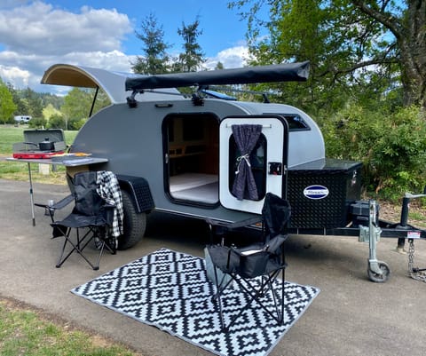 Rover is a 2018 Aero Steel HC and sleeps 2-1/2 with a small bunk that folds over the queen bed.