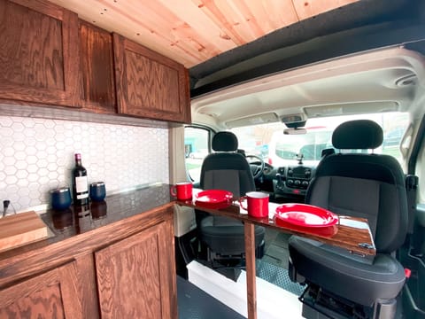 Flip up table for dinner, drinks, cards etc. Front seats swivel to be used at the table as well