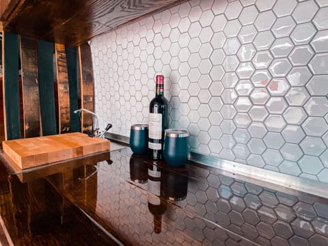 Kitchenette and sink with cutting board