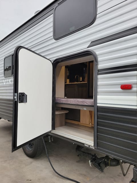 Storage area. Bunk bed folds upwards for more storage room