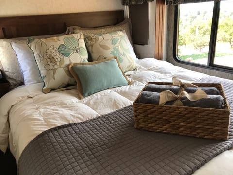 This mattress is a fluffy NEW Serta with new linens, pillows and allergy pillow covers. It is roomy and you will drift off to sleep! See the beautiful light coming in.