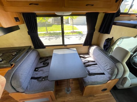 Dinette has 4 seatbelts and converts to small bed