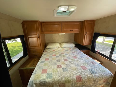 Comfortable bedroom with queen size bed. Has 120V plug for use with shore power or generator and 12V/USB plugs for use when running on 12V battery.