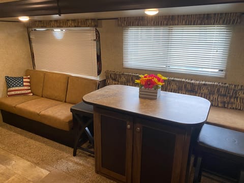 As you walk into the RV, you will see the couch and bar top