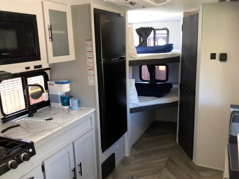 Fully stocked kitchen with 2 double bunk beds complete with linens, pillows and blankets.