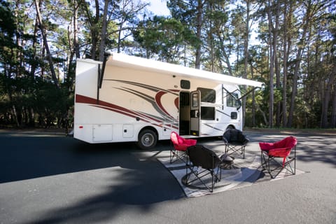 Relax in your camping chairs under the power awning