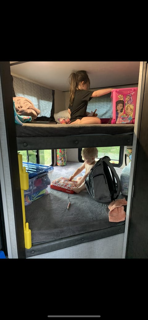 Two comfy beds each have lighting, USB ports and corner shelves for storage.