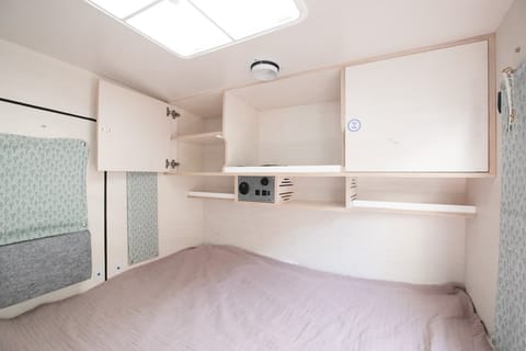 Queen size memory foam mattress with storage above and electric units  