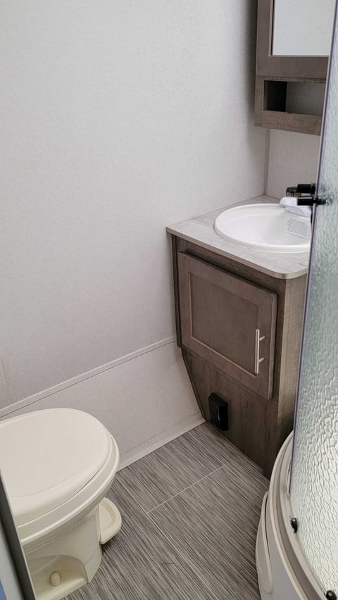 Single sink and roomy toilet area