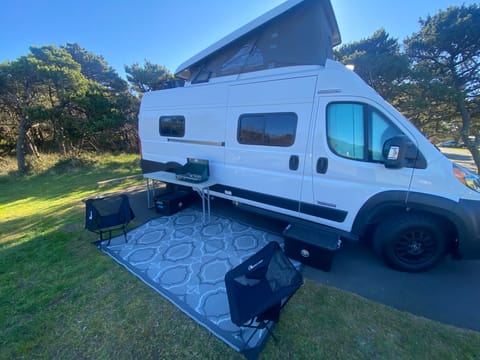 amenitites: 4 chairs, table, outdoor carpet & stove all come with the vans