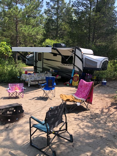 This shot was taken after a week of camping. Notice the extension of the awning relative to the picnic table below it.