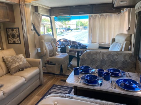 Main living area has a large slide out providing plenty of room.  The captain's chairs swivel and provide extra seating.  