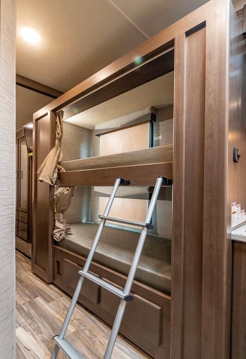 2 Bunk: each Bunk has Individualized Tv's with LED light and Privacy Curtain 