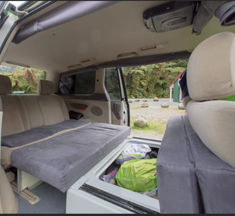 The full-sized bed pulls out to reveal the storage compartment. 