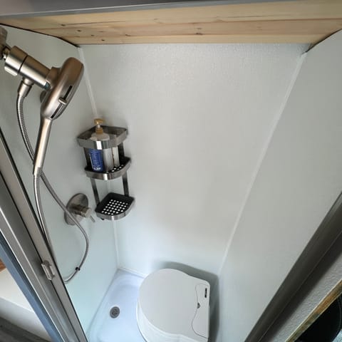 Shower with generous hot water and toilet (toilet can come out for more shower room.)