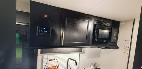 upper cabinets on kitchen with Steteo Bluetooth 