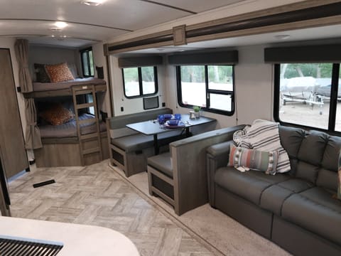 Living room and bunk beds in the rear