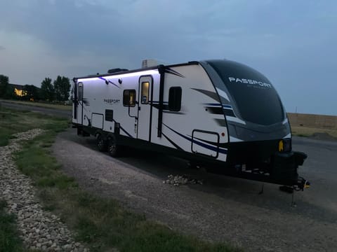 Camper has outdoor speakers, kitchen area, LED lights and electric awning 